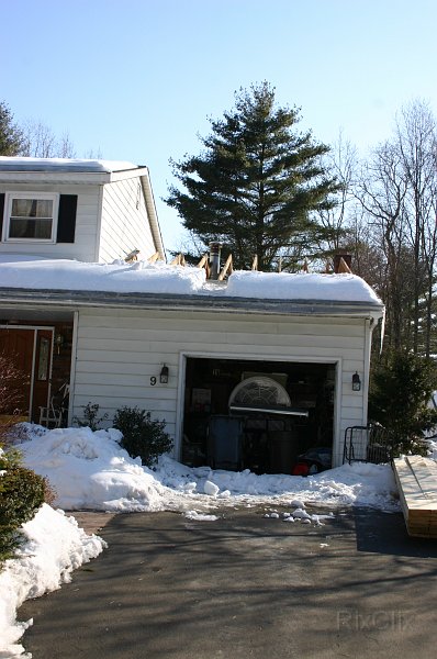 0011.jpg - The roof is removed above the garage and family room